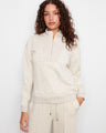 This soft scuba fabric top features a half-zip mock neck for versatile styling. Perfect for layering in any season. By Charlie B.