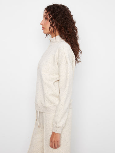 Long sleeves add to the comfort of this chic piece, making it a perfect addition to your wardrobe essentials. By Charlie B.