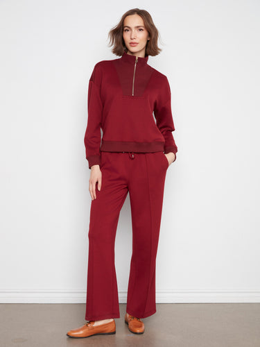 Brown half-zip sweatshirt showcasing a relaxed fit and long sleeves, perfect for casual comfort by Charlie B.