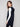 Elegant sleeveless vest in black with practical front patch pockets for added convenience by Charlie B.
