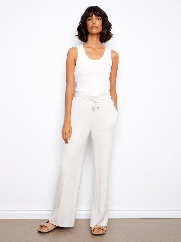 These pants feature a comfortable elastic waistband with drawstrings, perfect for a relaxed day. By Charlie B.
