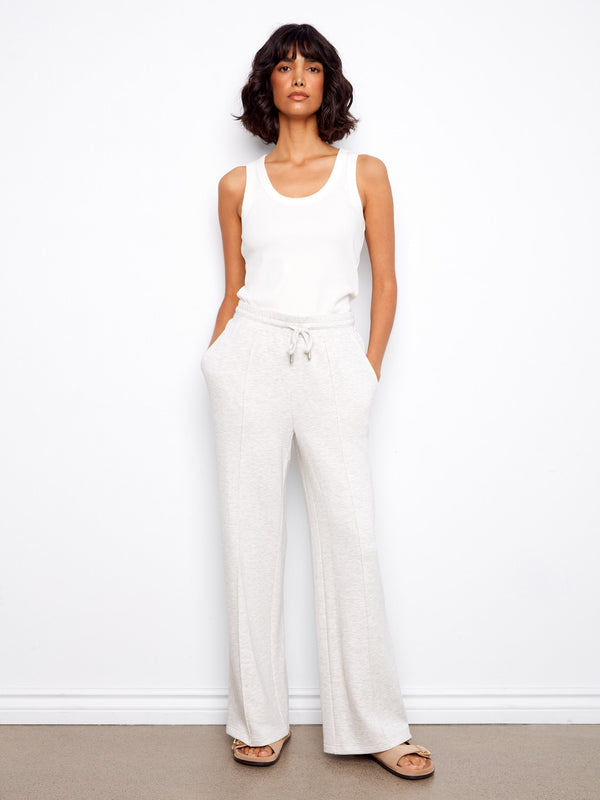 The long length of these pants adds an elegant touch to any outfit, making them versatile for various occasions. By Charlie B.