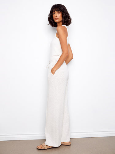 Featuring wide leg design, these pants offer both comfort and a chic silhouette for modern styling. By Charlie B.