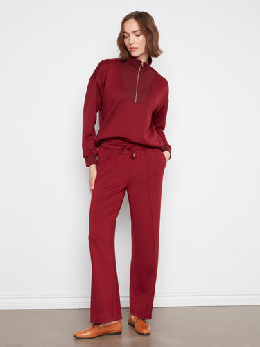 Designed with an elastic waistband and drawstring, these versatile pants ensure a comfortable fit all day long by Charlie B.