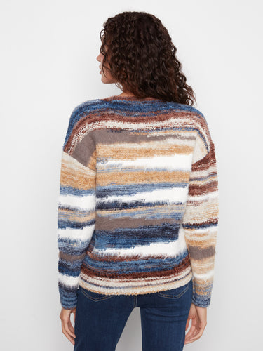 Cozy striped sweater highlighting the drop shoulders and rich earthy tones of the design by Charlie B.