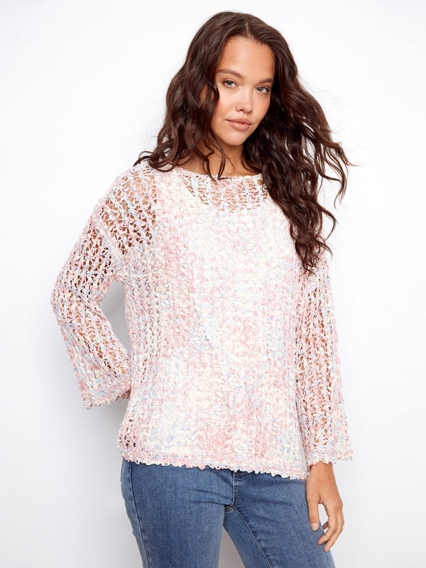 This stylish top features a classic crew neckline, offering a timeless look perfect for any occasion. By Charlie B.