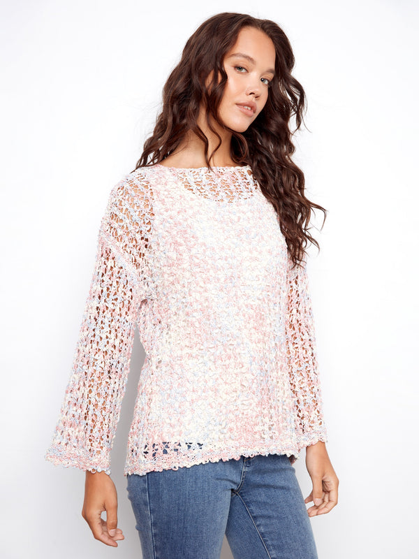 Featuring 3/4 sleeves, this versatile top is ideal for transitioning between seasons with ease. By Charlie B.