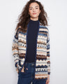 This cardigan features an open front design with a geometric pattern, perfect for layering. Crafted with long sleeves by Charlie B.