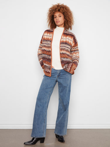 Cozy cardigan featuring practical side seam pockets, perfect for keeping essentials handy. By Charlie B.