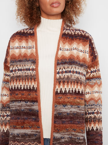 Charming knitwear with intricate patterns and an inviting open front style for casual elegance. By Charlie B.