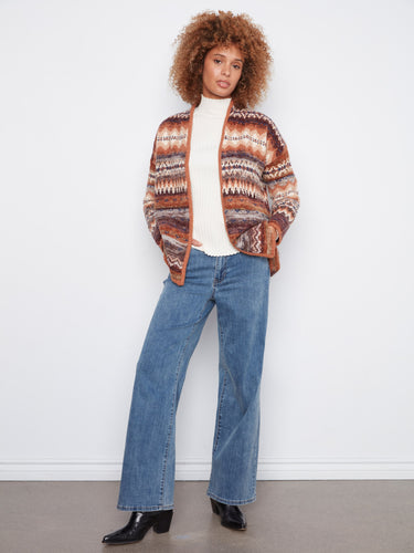 Trendy open front cardigan designed with attention to detail in its colorful patterning. Perfectly by Charlie B.