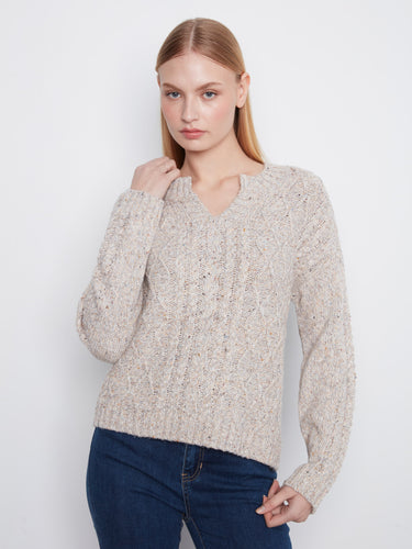 Sweater featuring a stylish notch neck and intricate knit pattern, perfect for casual outings. By Charlie B.