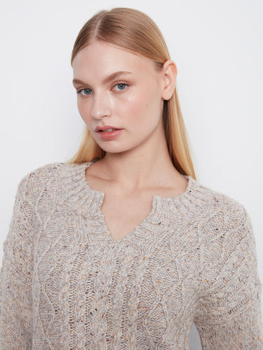 This sweater boasts a drop shoulder design, adding a relaxed touch to your wardrobe. By Charlie B.
