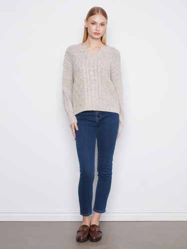 Crafted with speckled yarn, this sweater adds texture and visual interest to any outfit. By Charlie B.