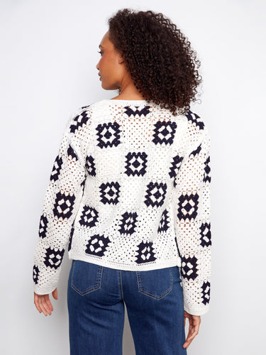 Stylish white cardigan showcasing a modern square crochet pattern, ideal for any outfit by Charlie B.