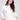White sweater adorned with subtle metallic stars, crafted from plush knit material for a cozy feel by Charlie B.