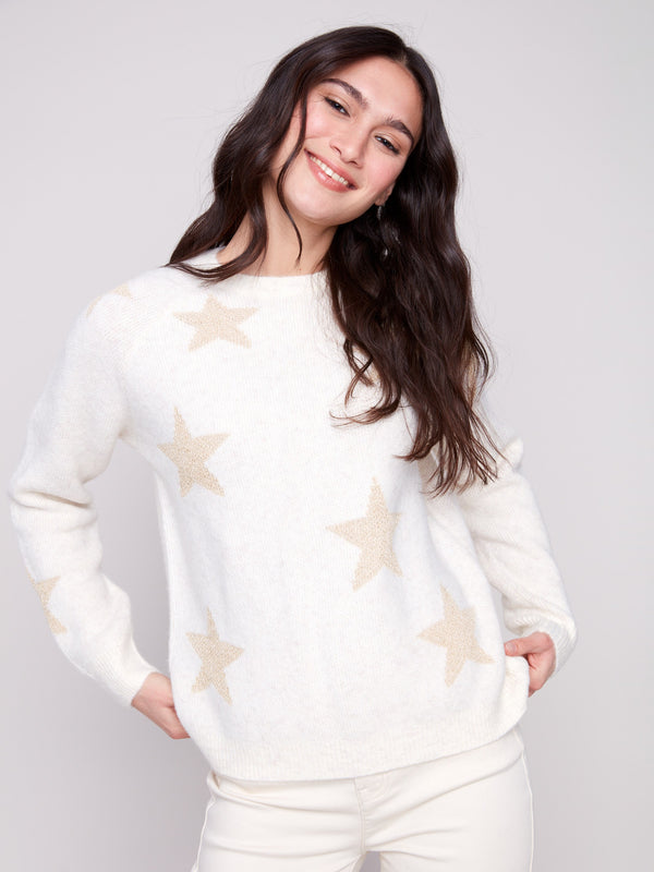 White sweater adorned with subtle metallic stars, crafted from plush knit material for a cozy feel by Charlie B.