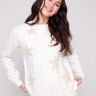White sweater adorned with subtle metallic stars, crafted from plush knit material for a cozy feel by Charlie B.
