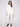 This white sweater features long raglan sleeves, offering a relaxed fit and stylish look by Charlie B.