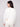 Elegant crew neck design on this plush knit white sweater with delicate star details by Charlie B.