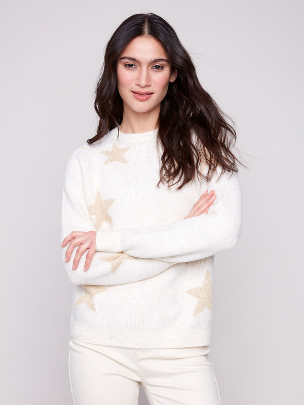 Raglan sleeve design in this soft white sweater adds comfort and style, complete with glittering stars by Charlie B.