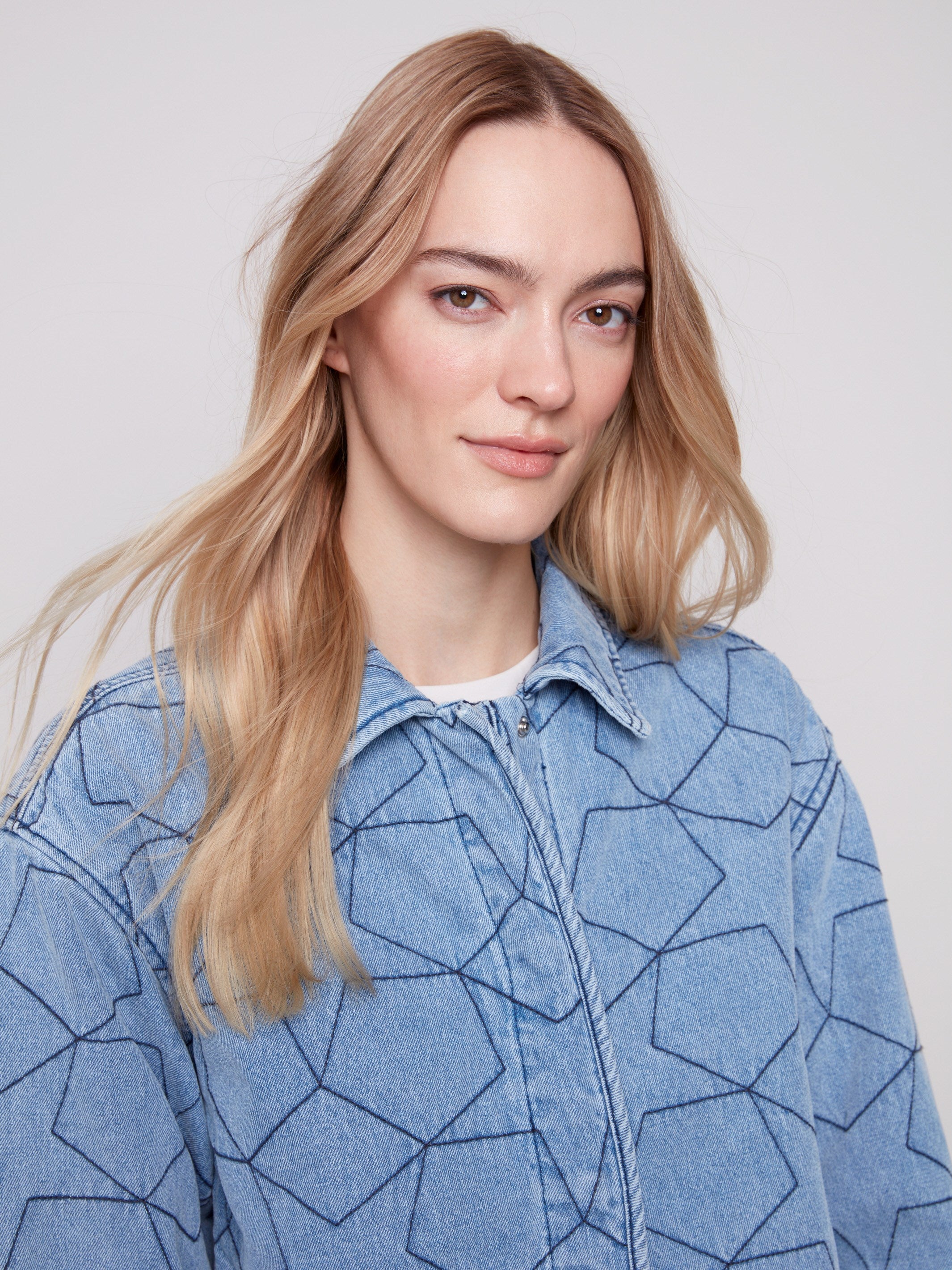 Fashionable denim piece showcasing a unique star quilt design and elegant shirt collar by Charlie B.