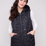Black vest with quilted stars and hood, featuring drawstrings for adjustable comfort by Charlie B.