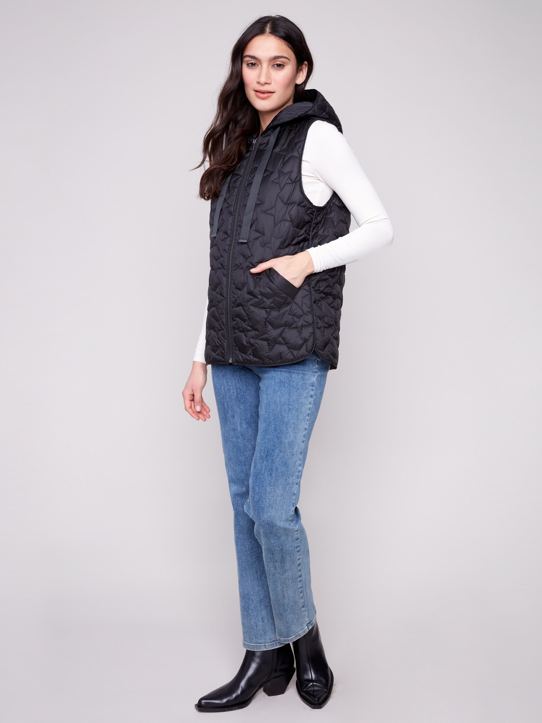 Stylish vest with a zipper front closure and star quilting, perfect for layering by Charlie B.