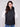 Quilted black vest with welt pockets, offering both style and functionality by Charlie B.