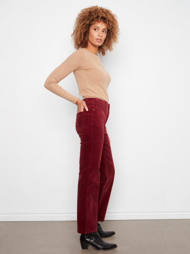 Experience the hidden elastic waistband in these pants, providing a seamless fit and ease of wear by Charlie B.