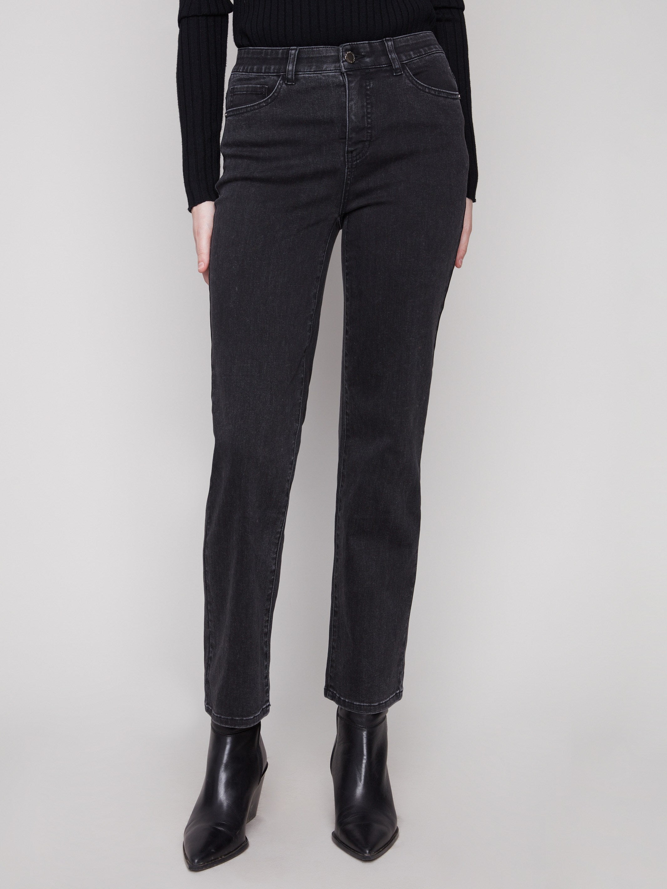 These jeans boast an elastic inside waistband, ensuring a comfortable fit by Charlie B.