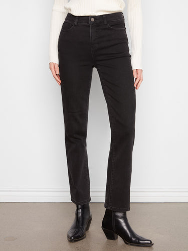 Long length black jeans featuring a zip fly and button closure by Charlie B.