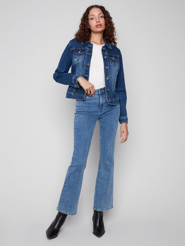 Indigo denim jacket featuring a spread collar and classic button front design by Charlie B.