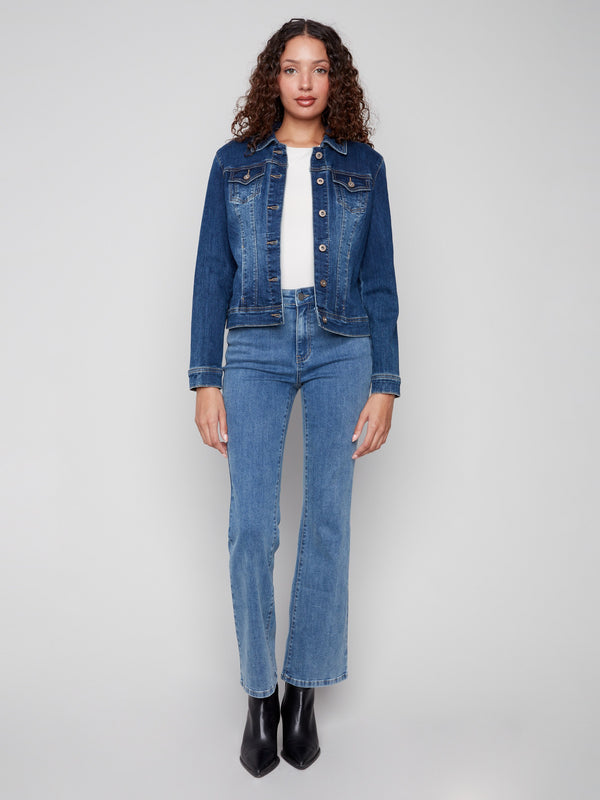 Indigo denim jacket with button front, flap pockets, and a classic collar by Charlie B.