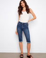 Woman in indigo pedal pushers with a regular rise, featuring a cuffed hem for added style by Charlie B.
