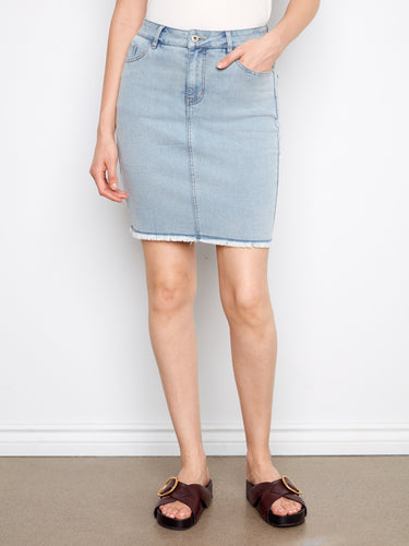 Frayed edges add a modern twist to this comfortable stretch denim skirt, ideal for casual outings. Fashioned by Charlie B.