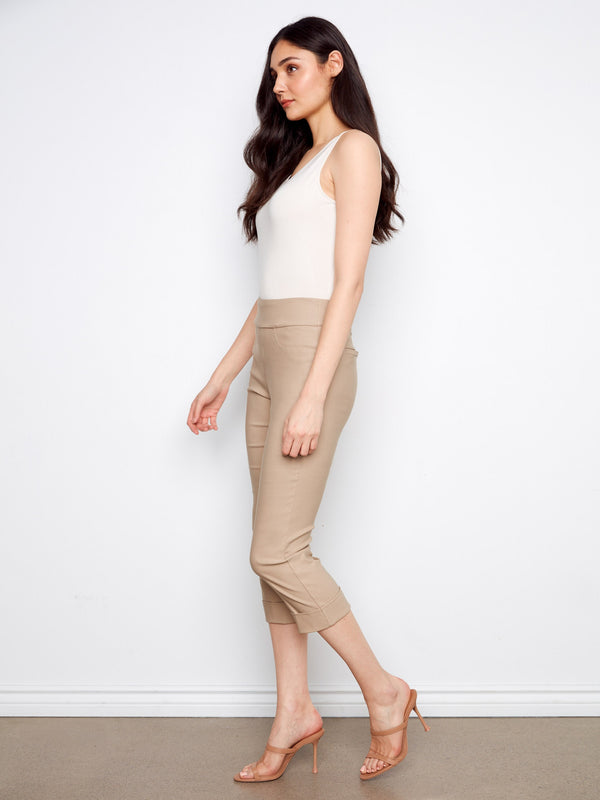 Elegant pull-on design capris in beige with cuffed hems, providing both style and ease of wear by Charlie B.