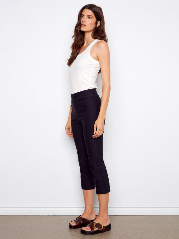 Featuring a cuffed hem, these capri pants add an elegant touch to your wardrobe essentials by Charlie B.