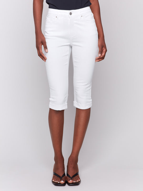 Cropped length white pedal pusher pants featuring a classic five-pocket design by Charlie B.
