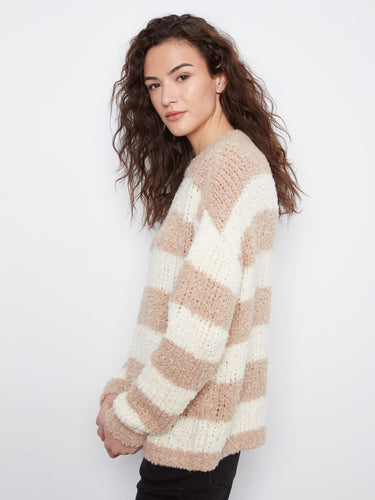 A chic crew neck enhances the elegance of this soft striped sweater by Charlie B.