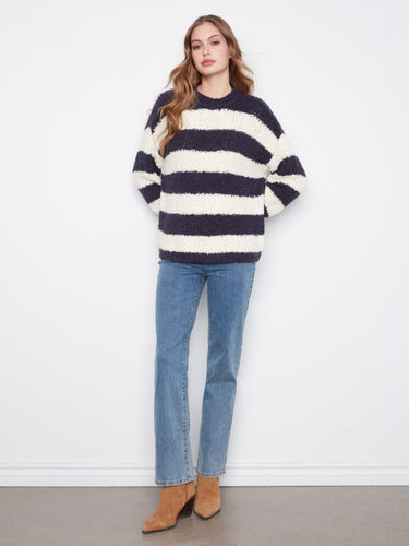 Enjoy the drop shoulder design on this striped sweater, offering a relaxed yet chic look. Made with care by Charlie B.