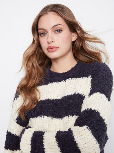Long sleeves add warmth and style to this striped sweater, ideal for cooler days. A must-have piece by Charlie B.