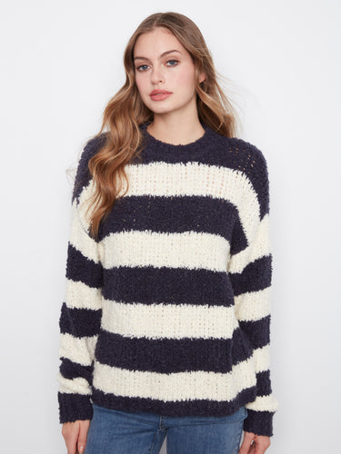 This striped sweater features a soft texture and classic design, making it versatile for any wardrobe. By Charlie B.