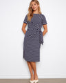 Navy striped dress with a chic boat neckline, showcasing its elegant design and style by Charlie B.