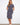 Navy striped dress with a chic boat neckline, showcasing its elegant design and style by Charlie B.