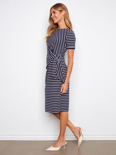 Navy striped dress with a flattering tie waist, adding definition and style to the outfit by Charlie B.