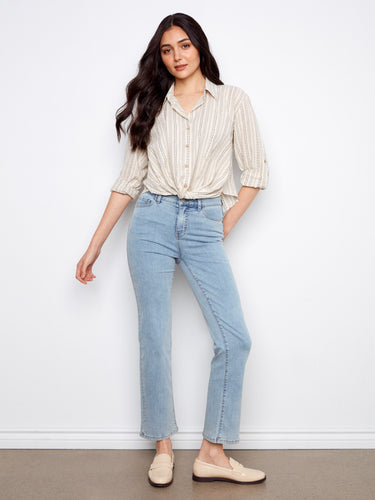 Fashionable shirt with front twist detail, adding a chic touch to your outfit. Perfect for casual or formal settings by Charlie B.