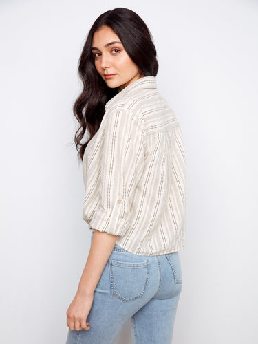 Stylish striped shirt showcasing a unique front twist design, enhancing its modern appeal. A creation by Charlie B.