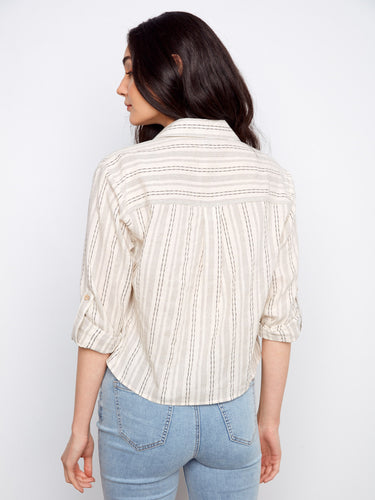 Casual yet sophisticated shirt adorned with roll-up sleeves and button tabs, ideal for everyday wear. Designed by Charlie B.