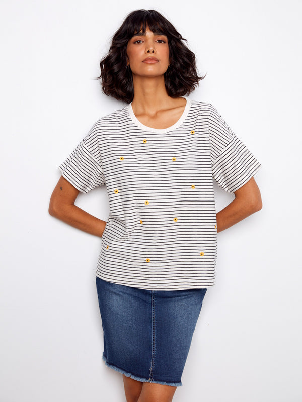 Casual striped tee showcasing an elegant crew neck and embroidered flowers by Charlie B.